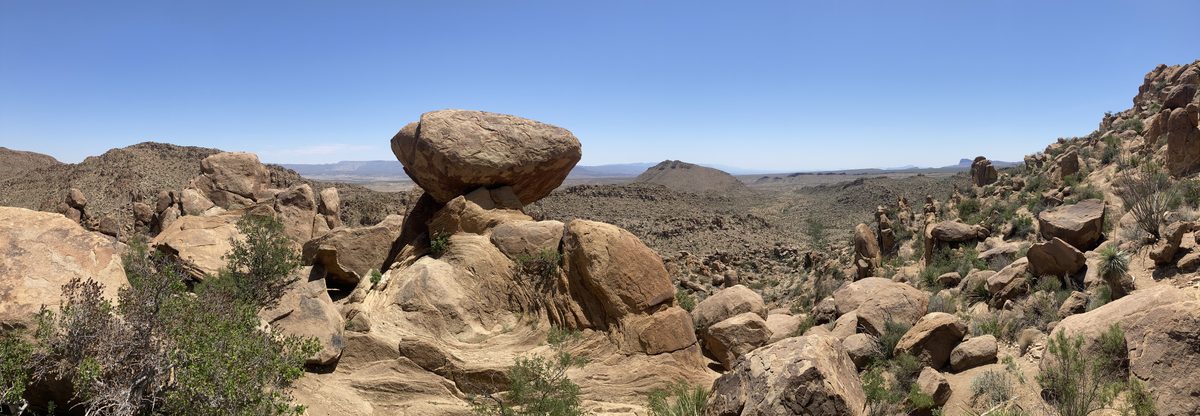 Balanced boulder, desert landscape
